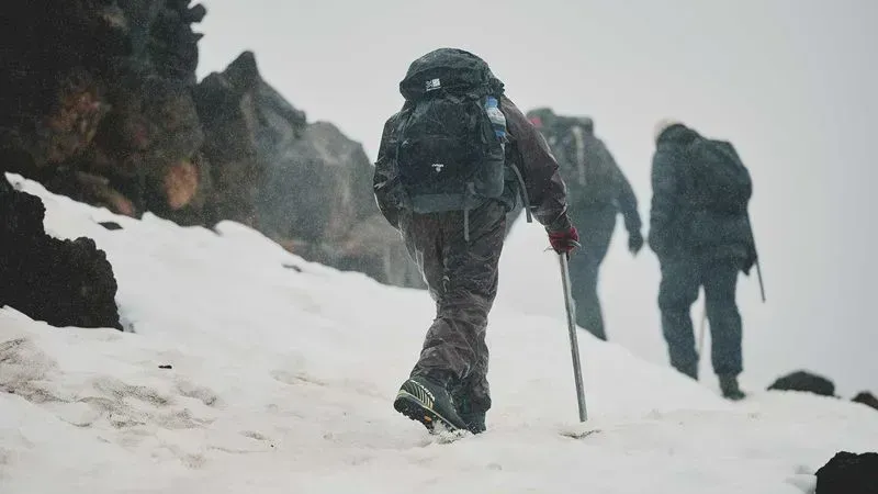 A group of hikers trek up a snowy mountain trail, showcasing teamwork and resilience. This outdoor adventure highlights St. Peter's School’s commitment to experiential learning and encourages students to embrace challenges in nature.