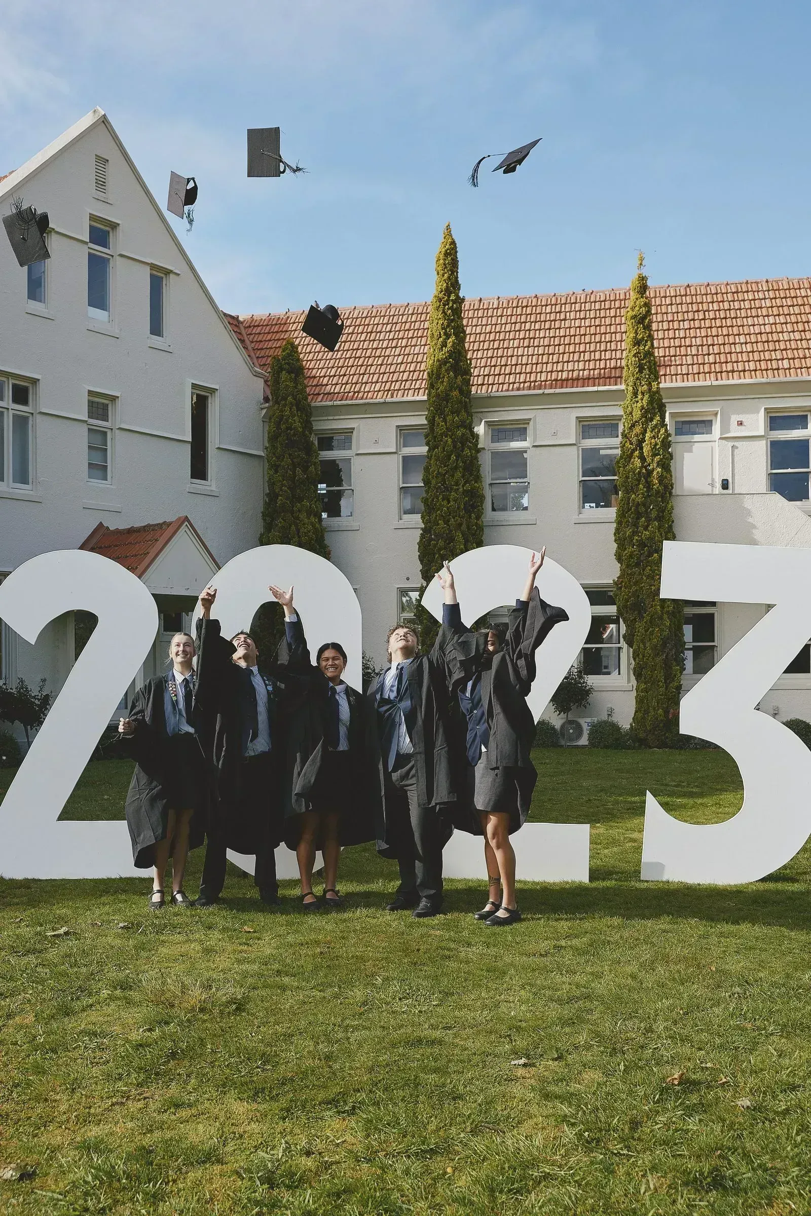 A stained glass window with the original owl and crest