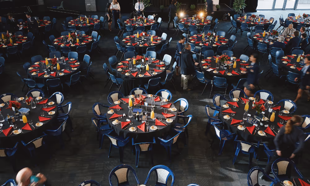 Two students riding bikes on campus