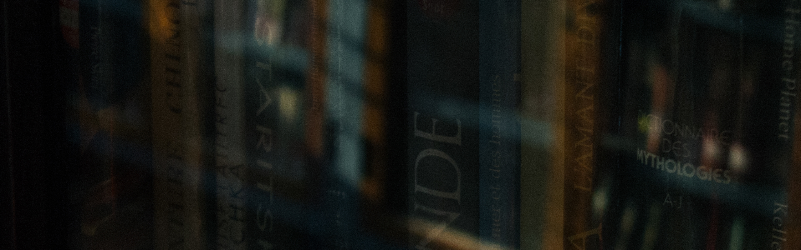 a look into a book shelve through the transparent window