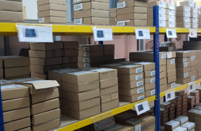 Image of a warehouse with stocks organised in shelves