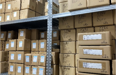 Image of a warehouse with stocks organised in shelves