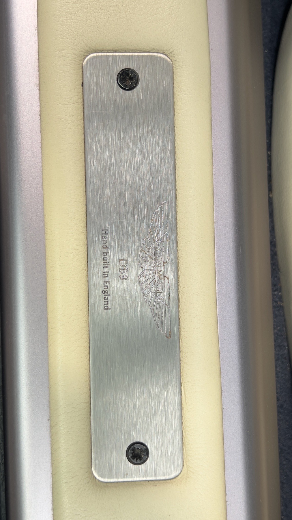 Aston Martin DB9 door sill plate engraved 'Hand built in England'