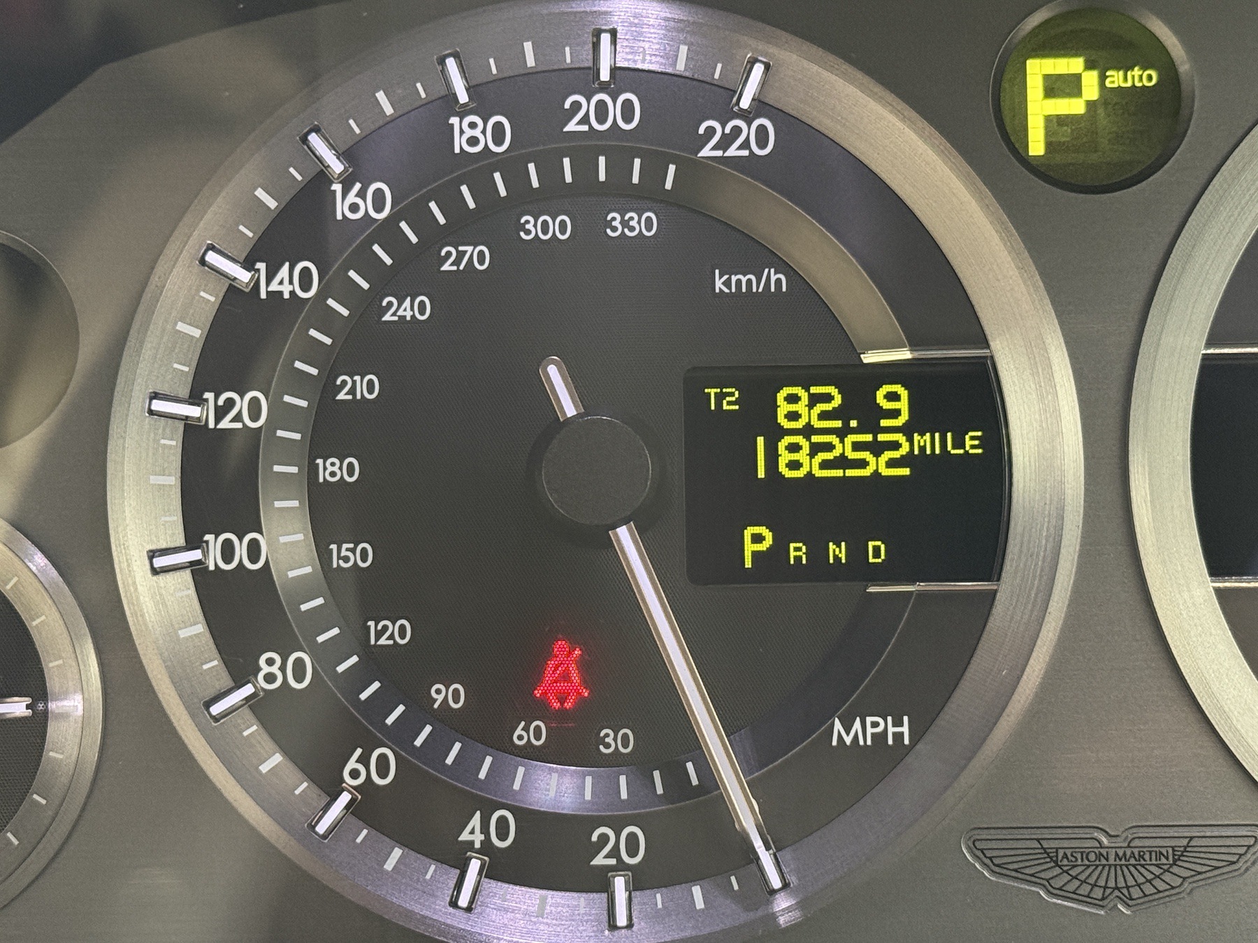 Aston Martin DB9 instrument cluster showing 18,252 recorded miles