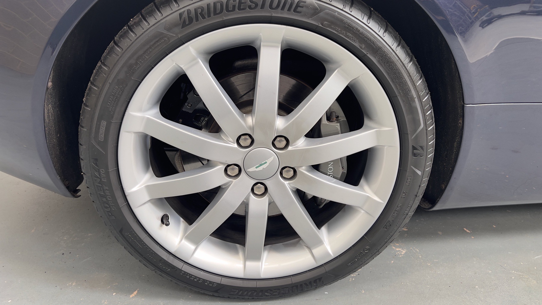 Aston Martin DB9 alloy wheel fitted with a Bridgestone tyre