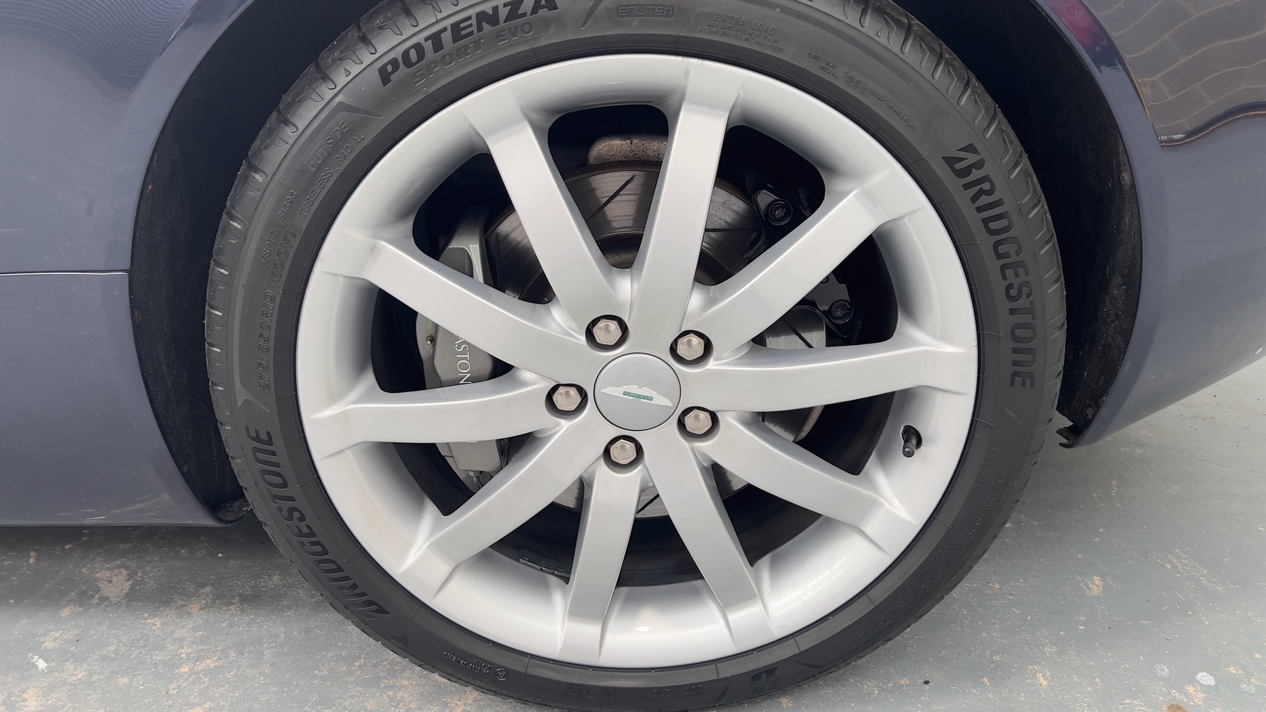 Aston Martin DB9 alloy wheel shod with a Bridgestone Potenza tyre