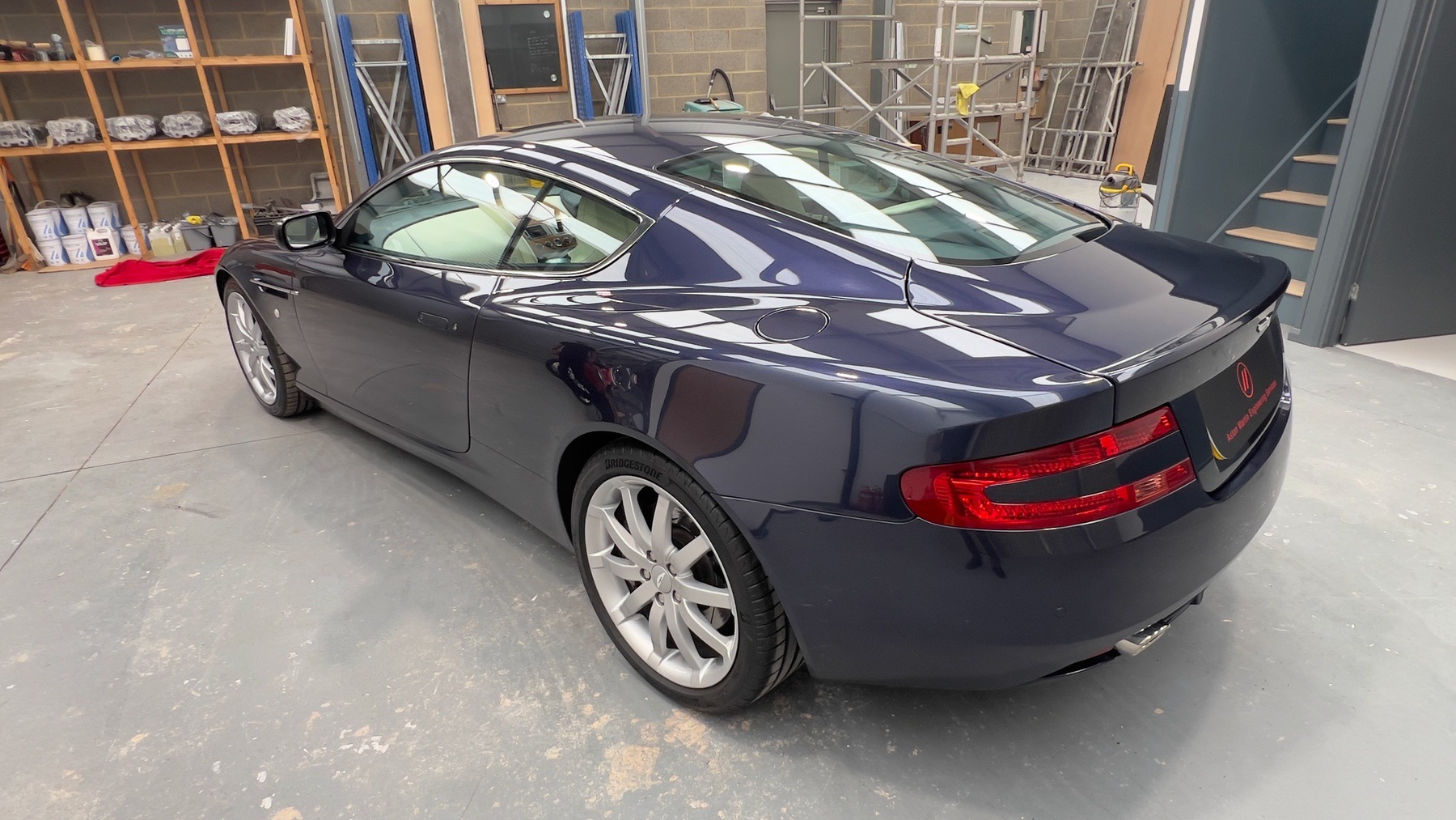 Aston Martin DB9 from the rear nearside, showing the boot lid spoiler and tail lights