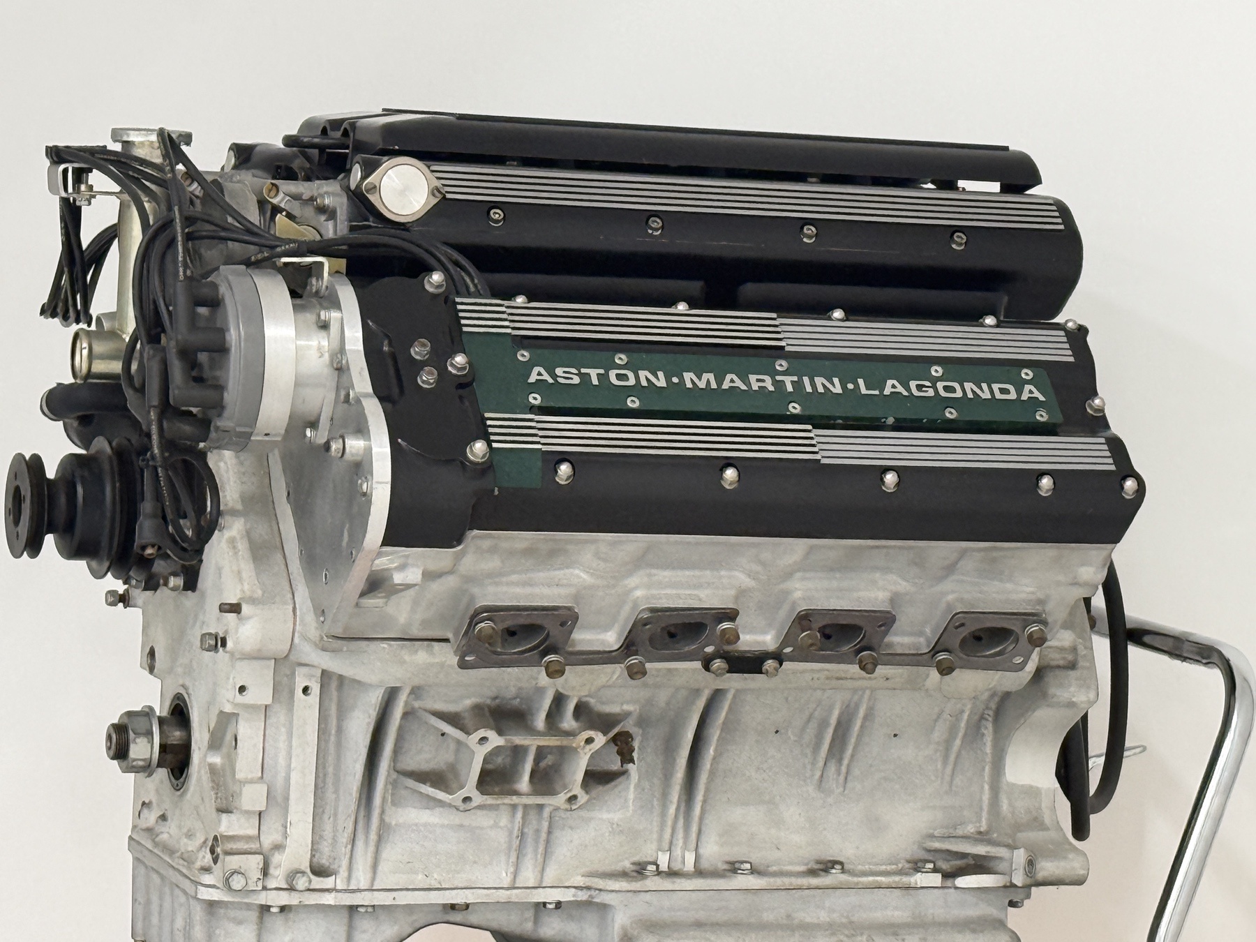 Aston Martin 7.3 litre V8 engine showing the exhaust ports and multi-valve cylinder heads