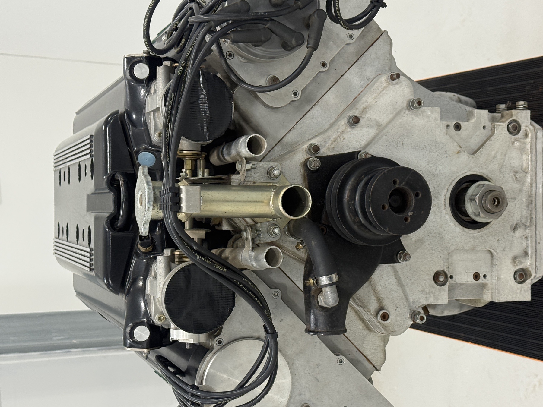 Front of the Aston Martin 7.3 litre V8 engine with water pump housing and crank pulley