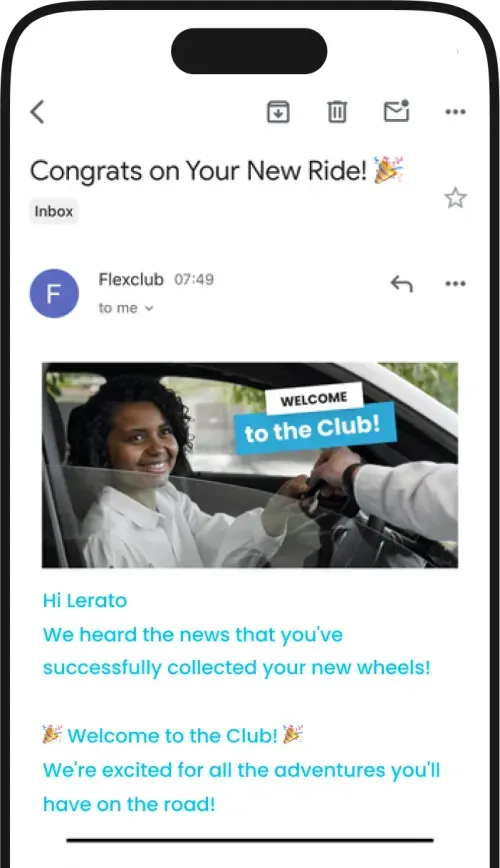 a cell phone with a photo of a woman driving a car