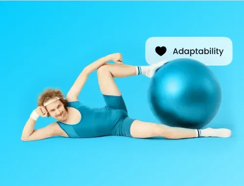 a man in a blue leotard laying on top of a blue ball