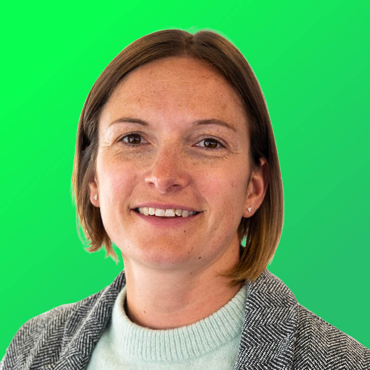 Headshot of Angela Heap on a green background