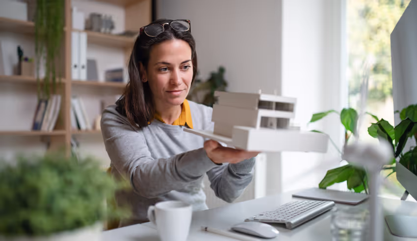 Woman looking at architectural model