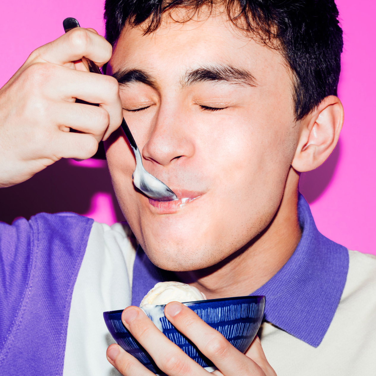Image of teenage boy eating ice cream in a bowl