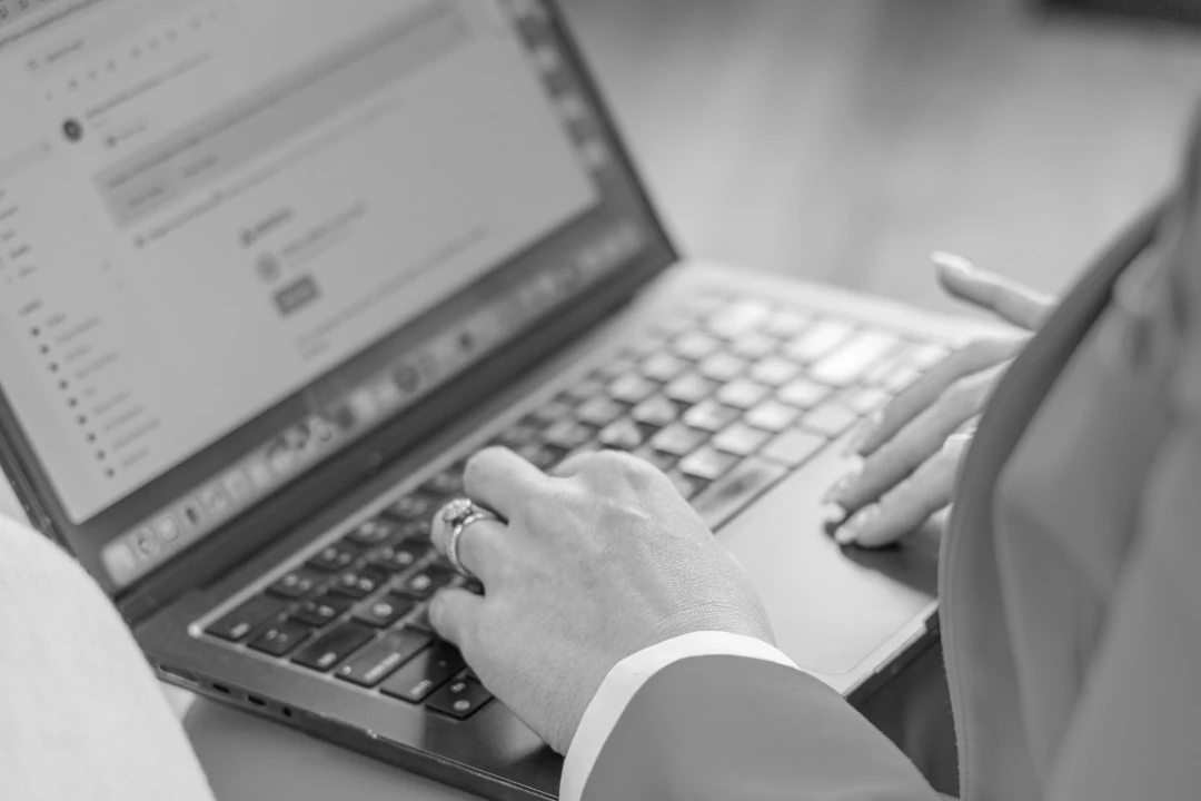 hand resting on laptop keyboard