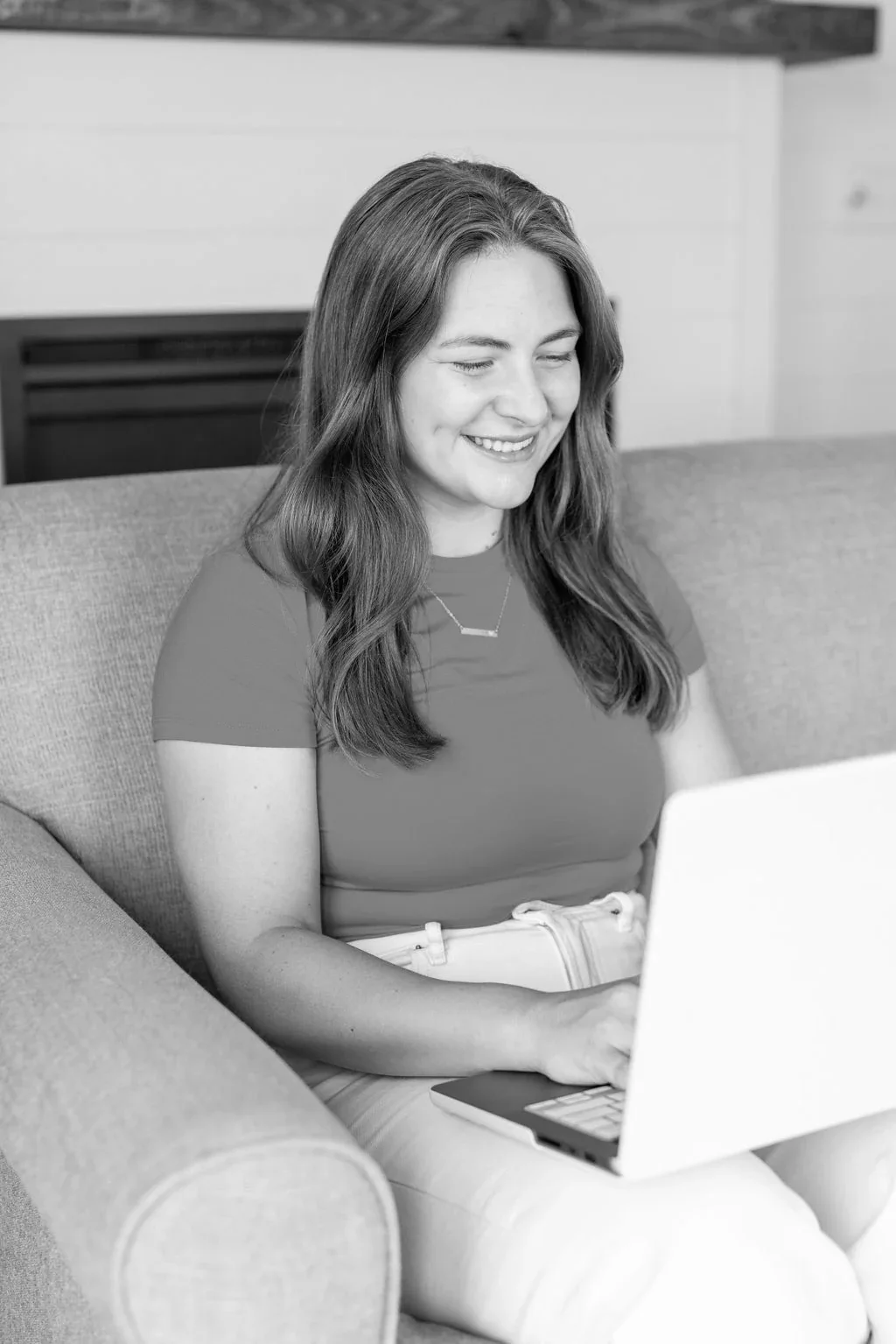 woman sitting with laptop on lap