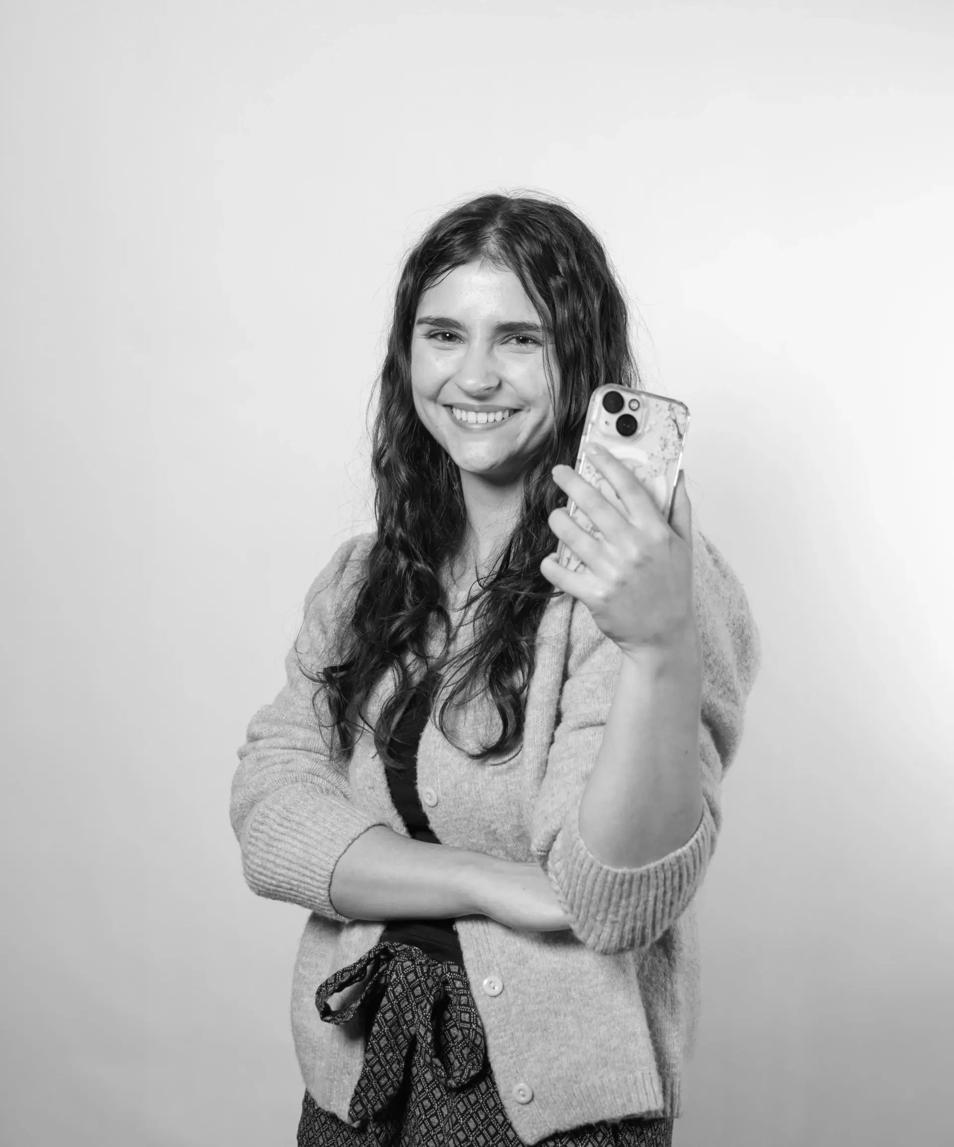 social media manager holding phone