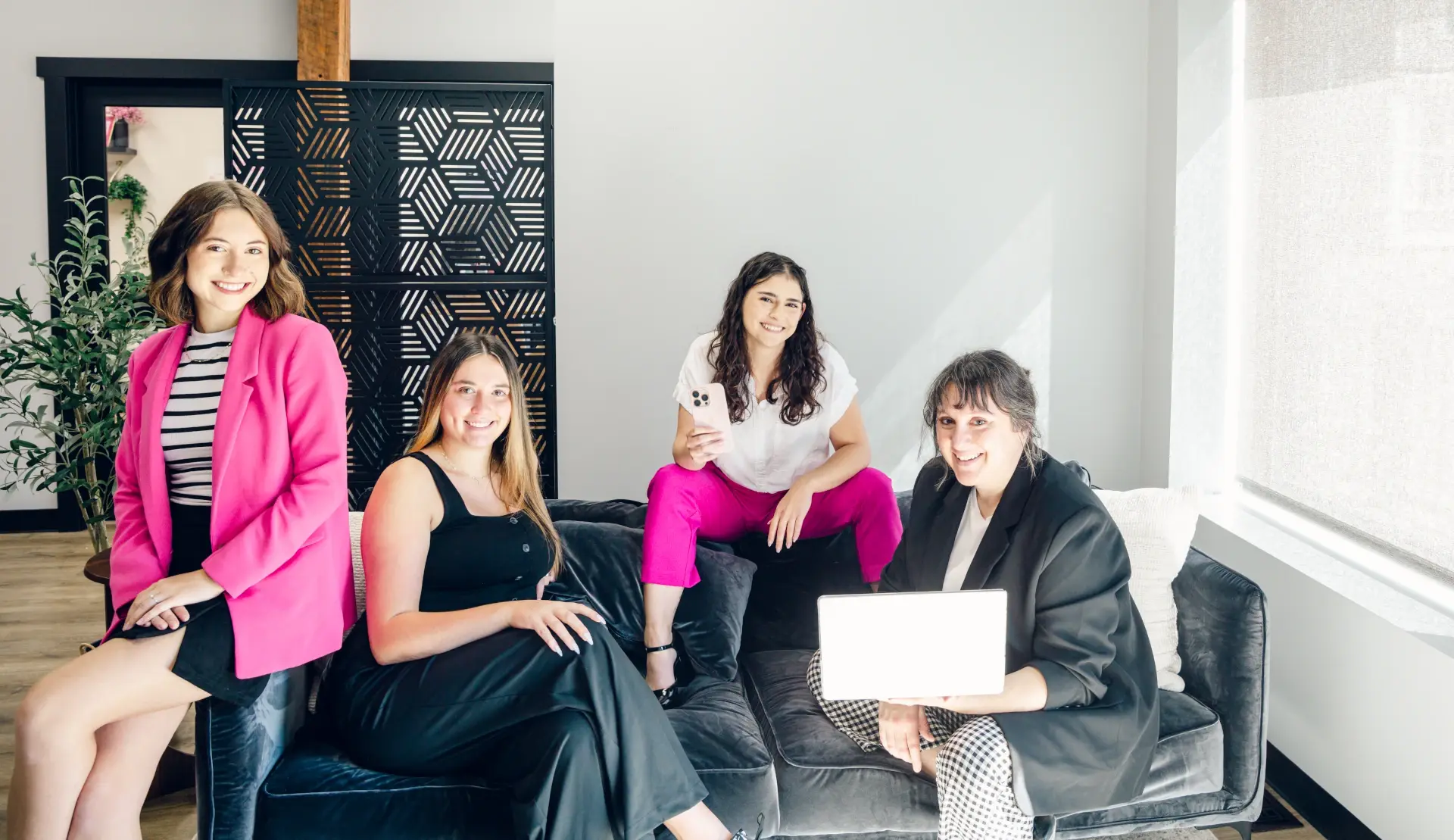 fierce social media team sitting on couch