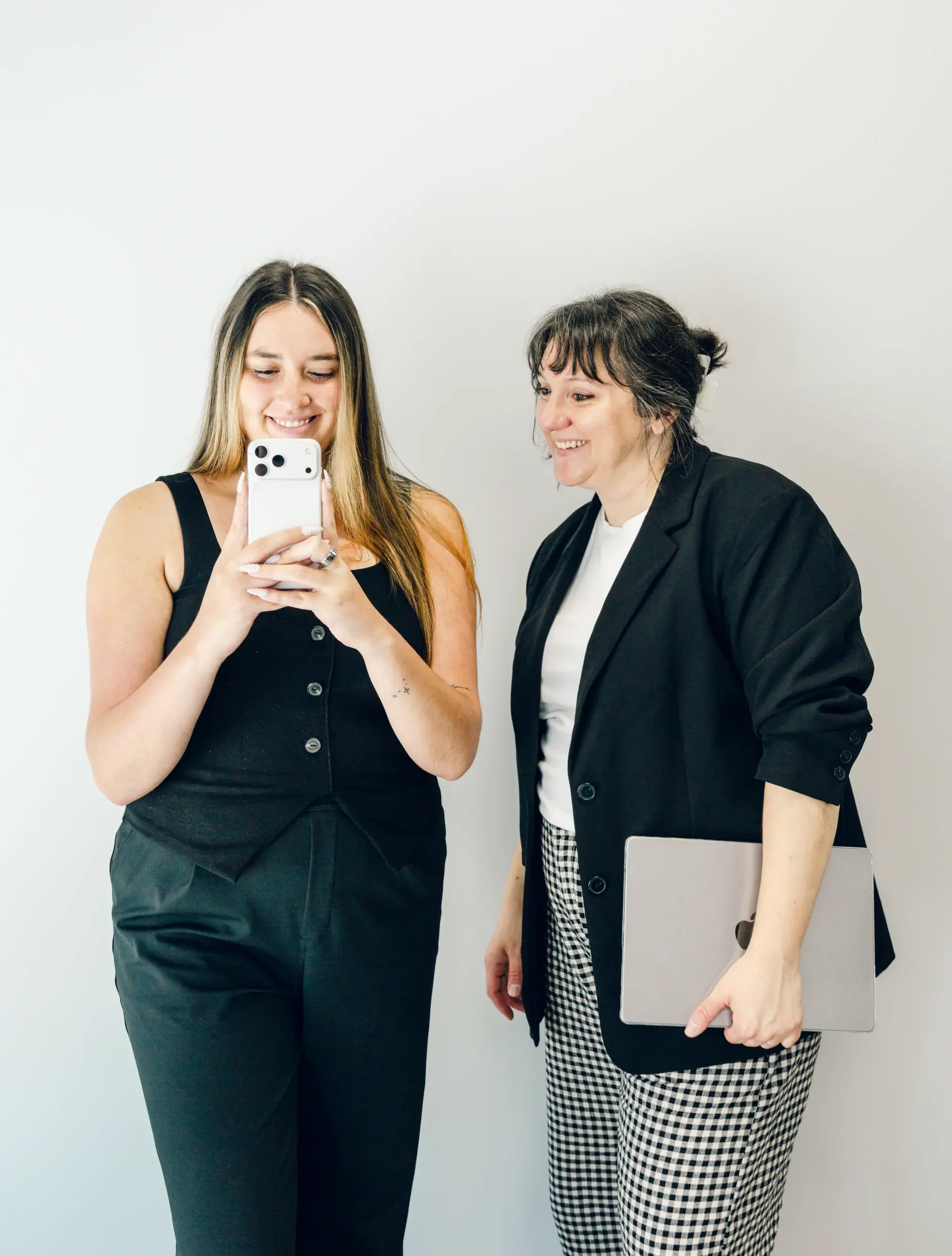 liv and bri looking at phone