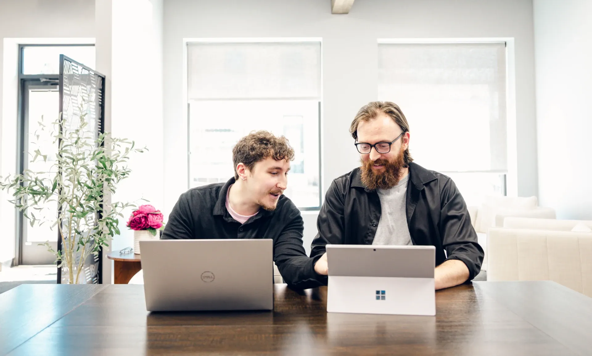 fierce web dev team looking at laptop