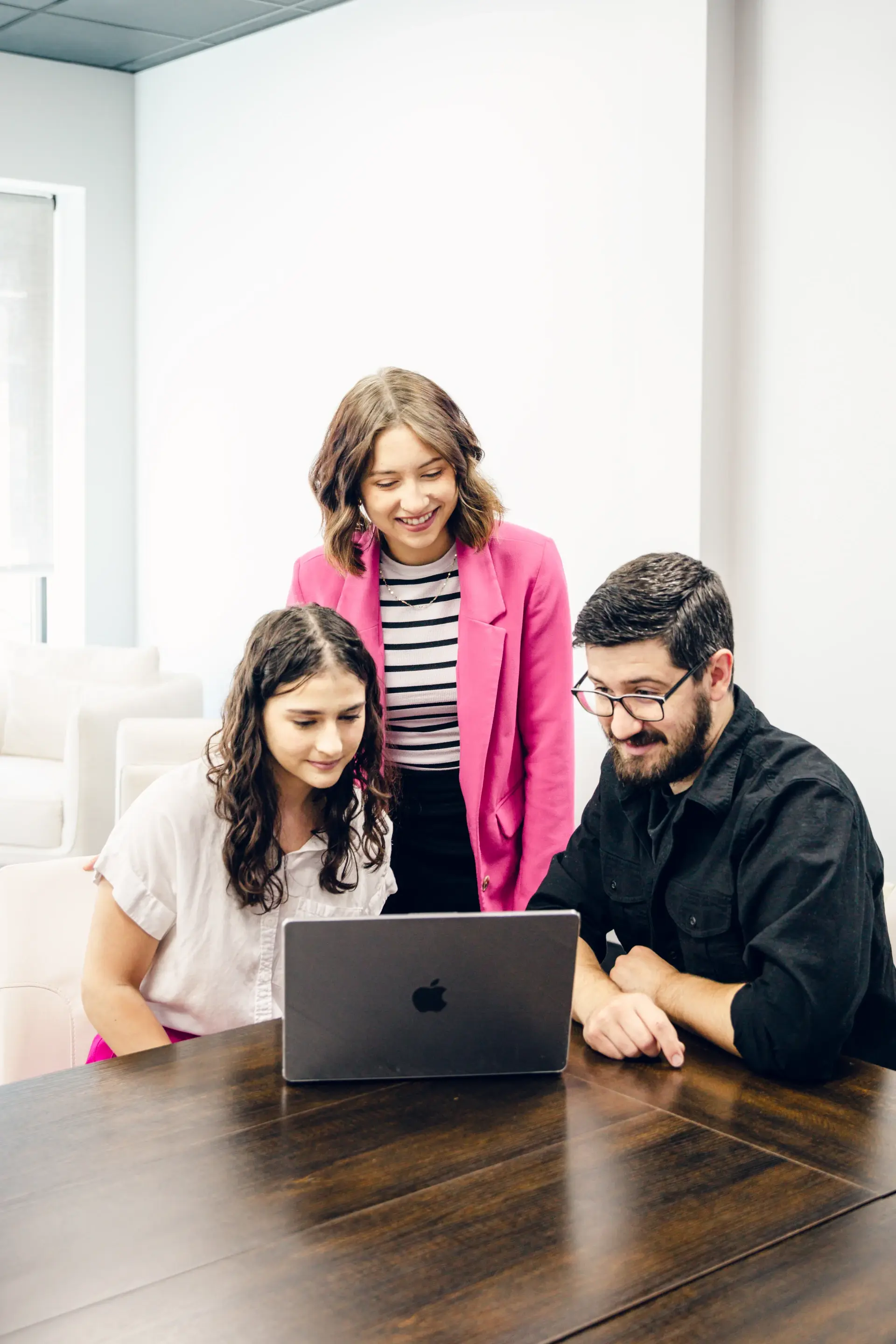fierce photo video team looking at laptop
