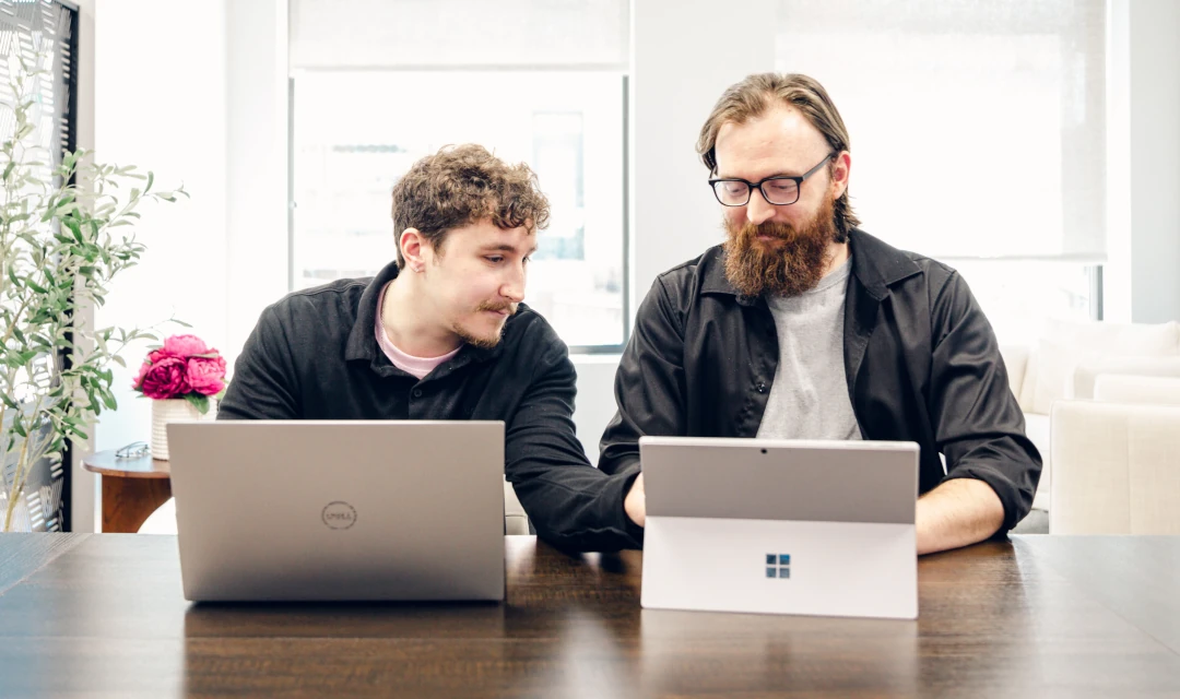 fierce workers working together on laptops