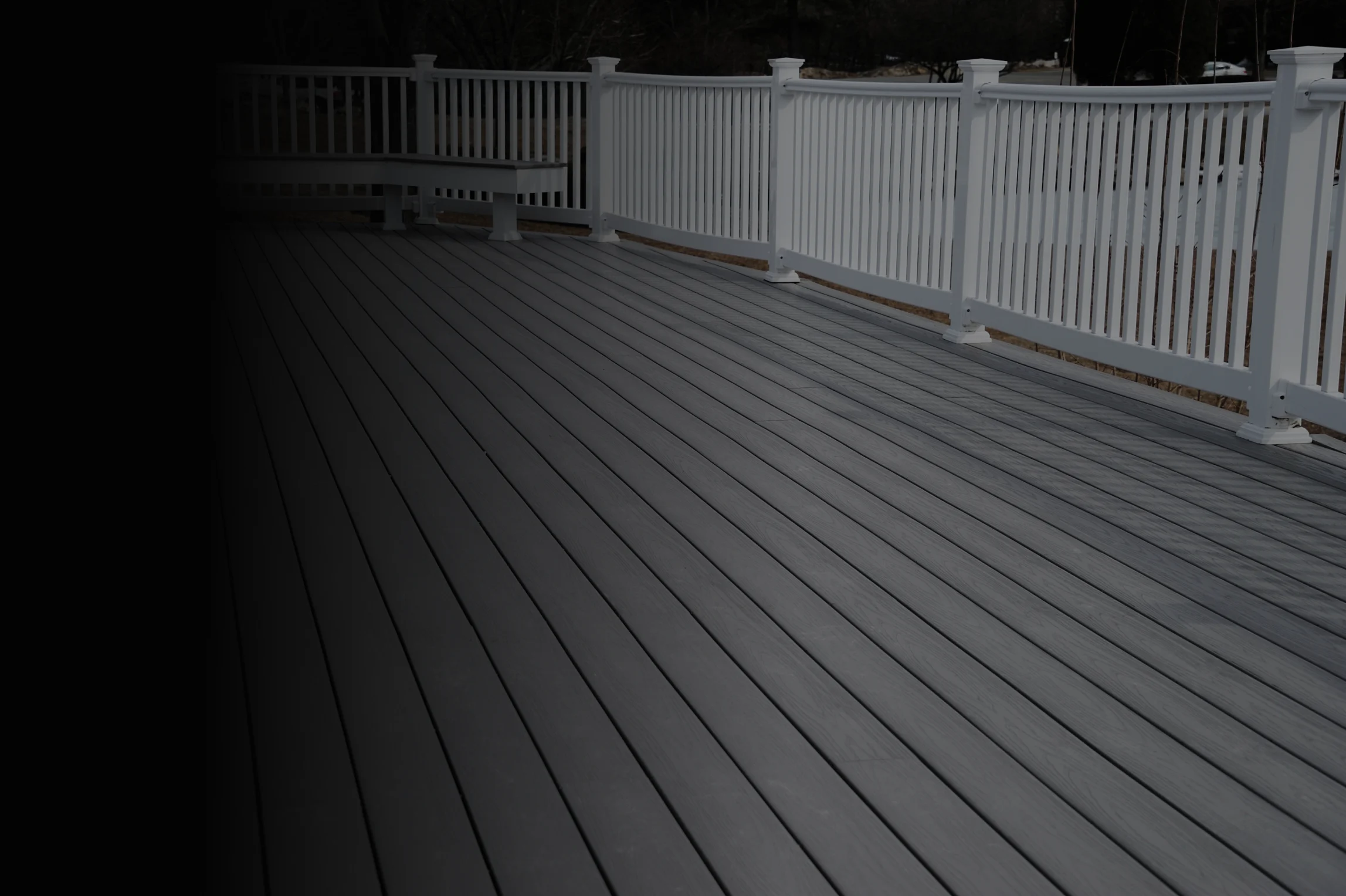 residential deck with railing and bench