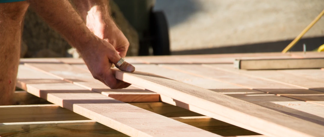 placing wooden boards down in line