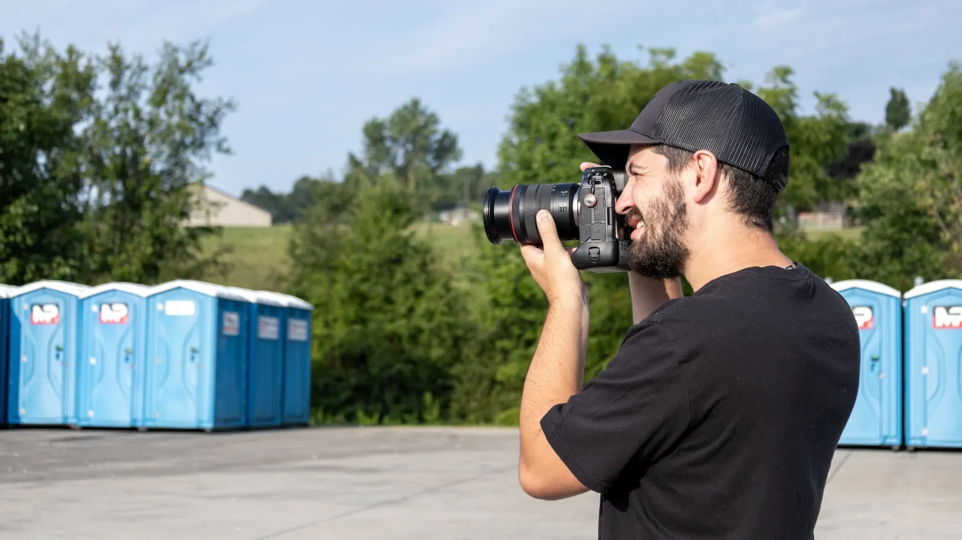 man holding camera taking videos