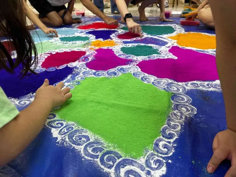 ↳ Participatory Rangoli by Vijaya Mohan