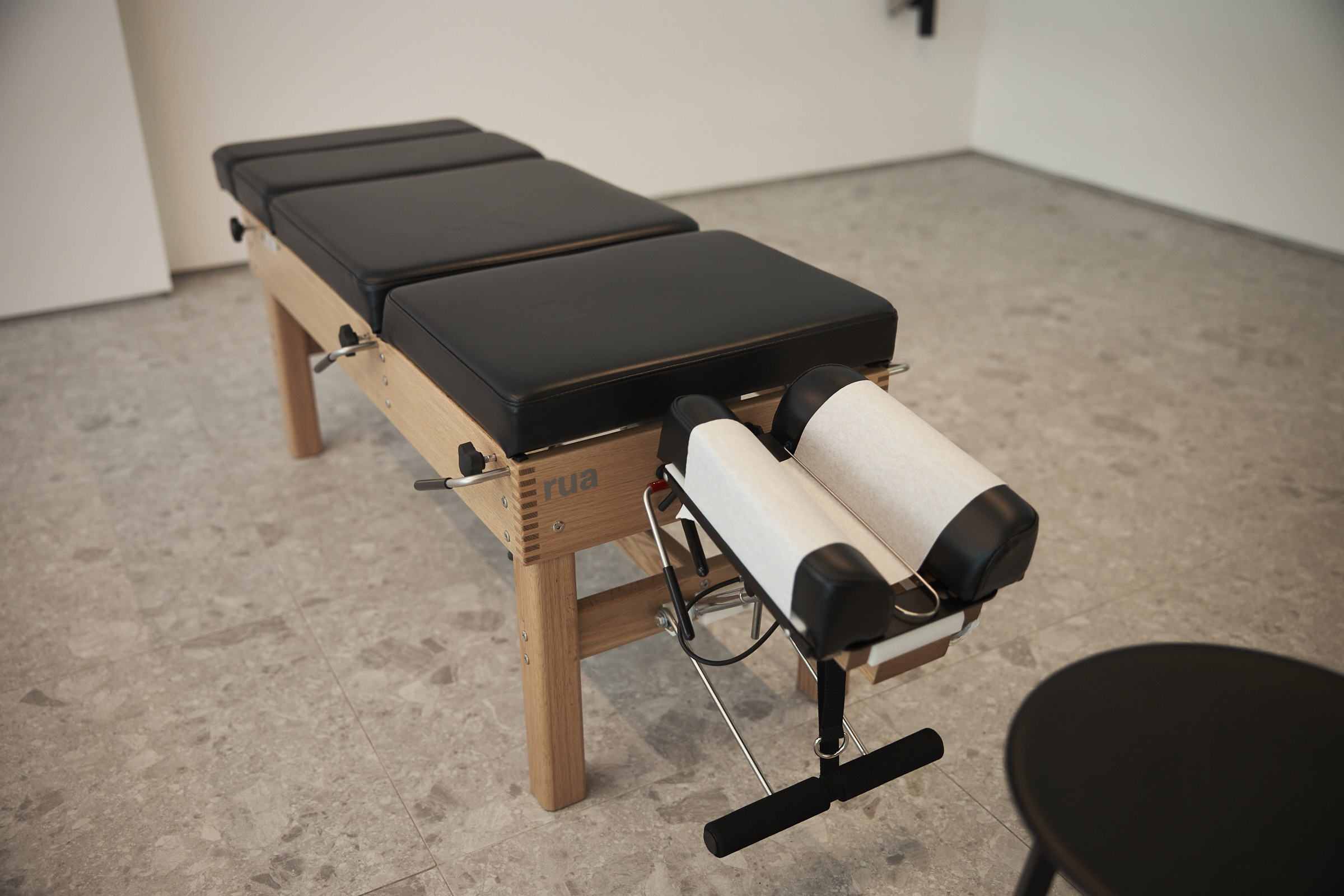 Timber and leather chiropractic adjustment table at BRAIN TO BODY®