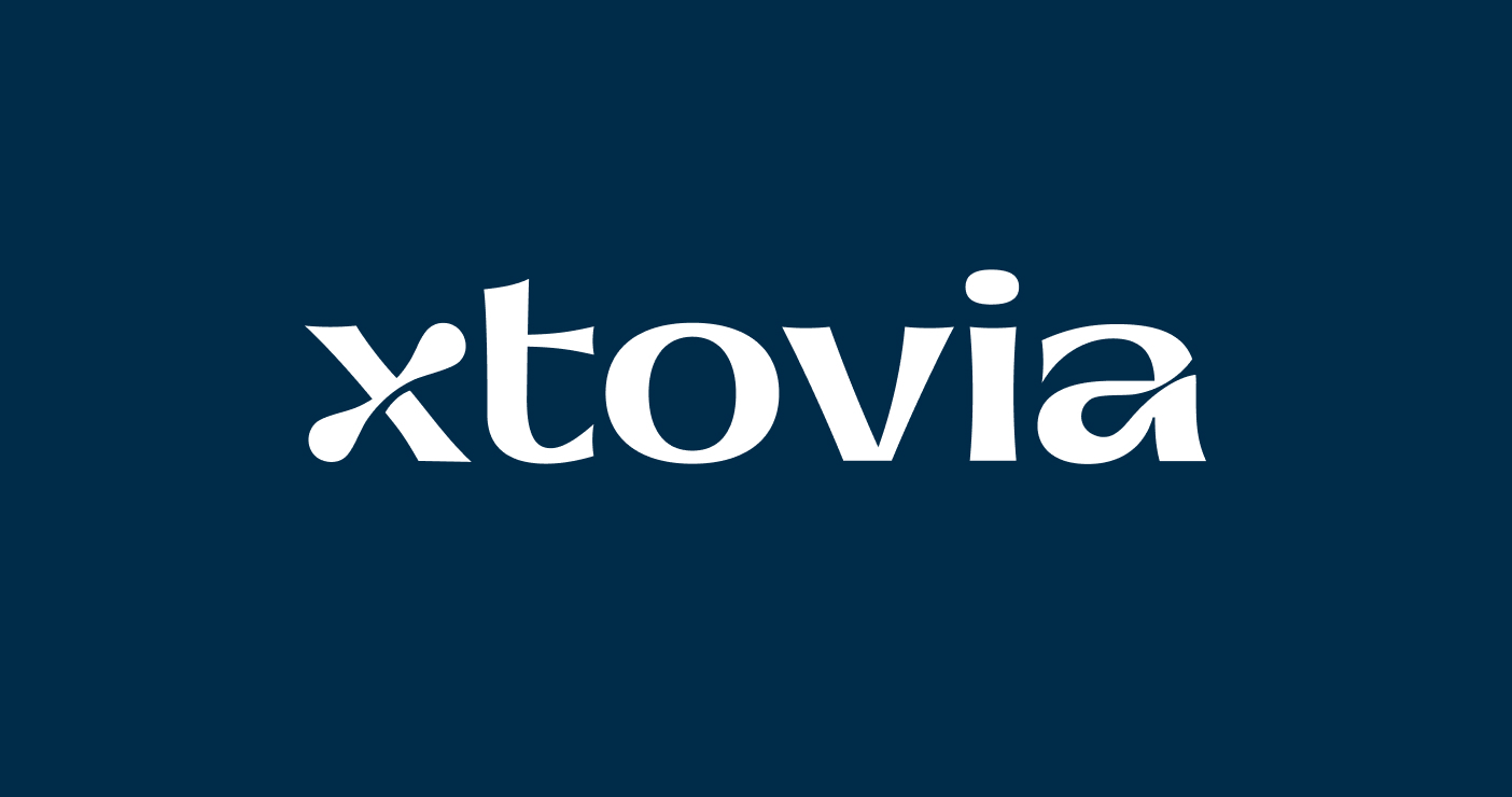 White Xtovia logo displayed on a solid navy blue background.