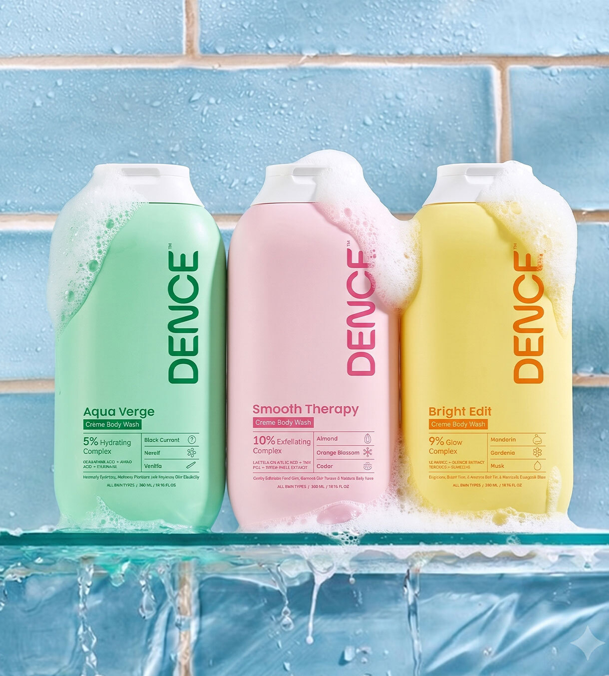 Three Dence body wash bottles featuring Aqua Verge, Smooth Therapy and Bright Edit displayed with soap foam against a refreshing blue tiled bathroom backdrop.