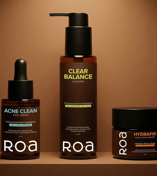 ROA skincare products, including a cleanser, face serum and moisturiser, displayed against a warm brown background.