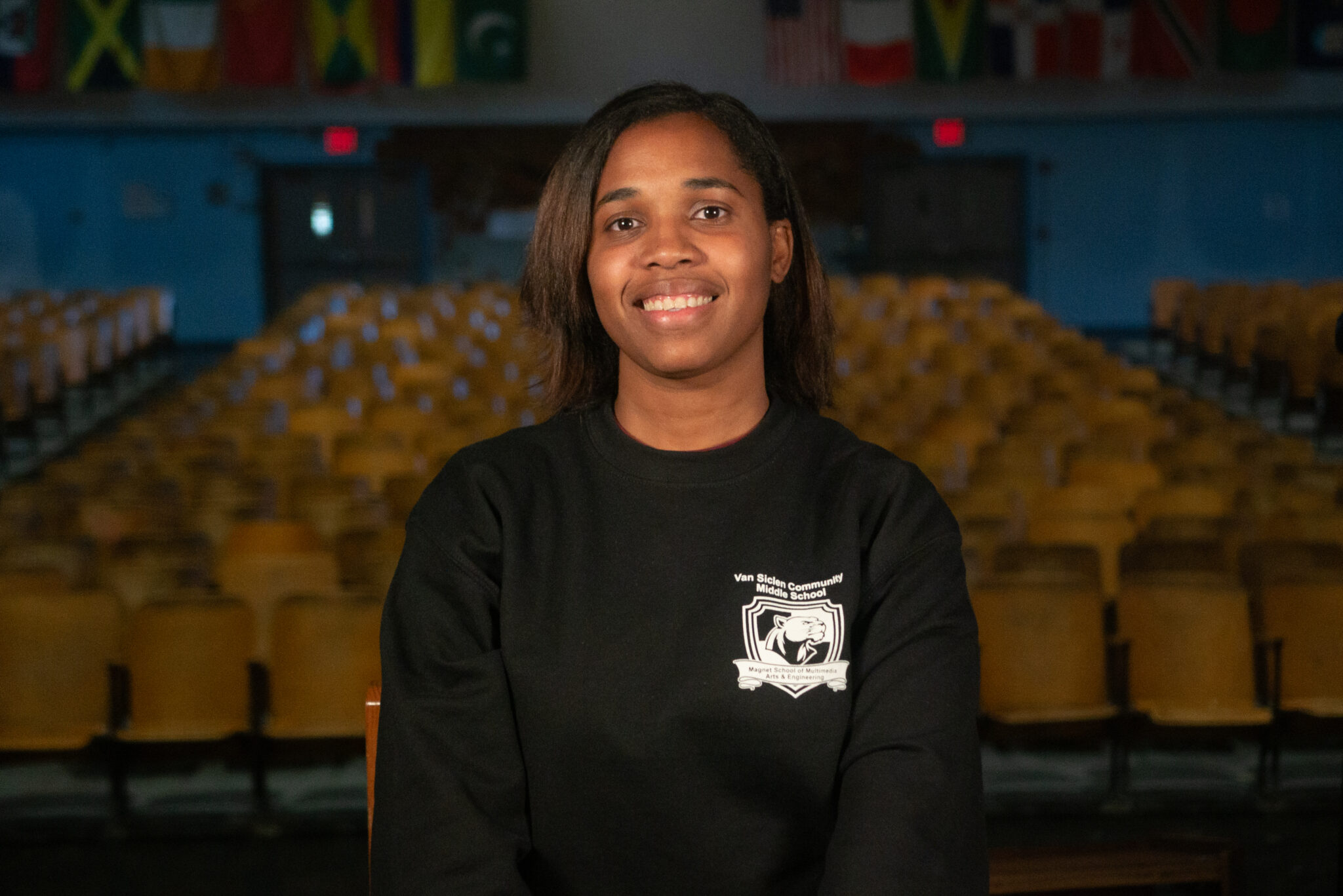 Patricia Osterwalder smiling in Van Siclen Community Middle School sweatshirt