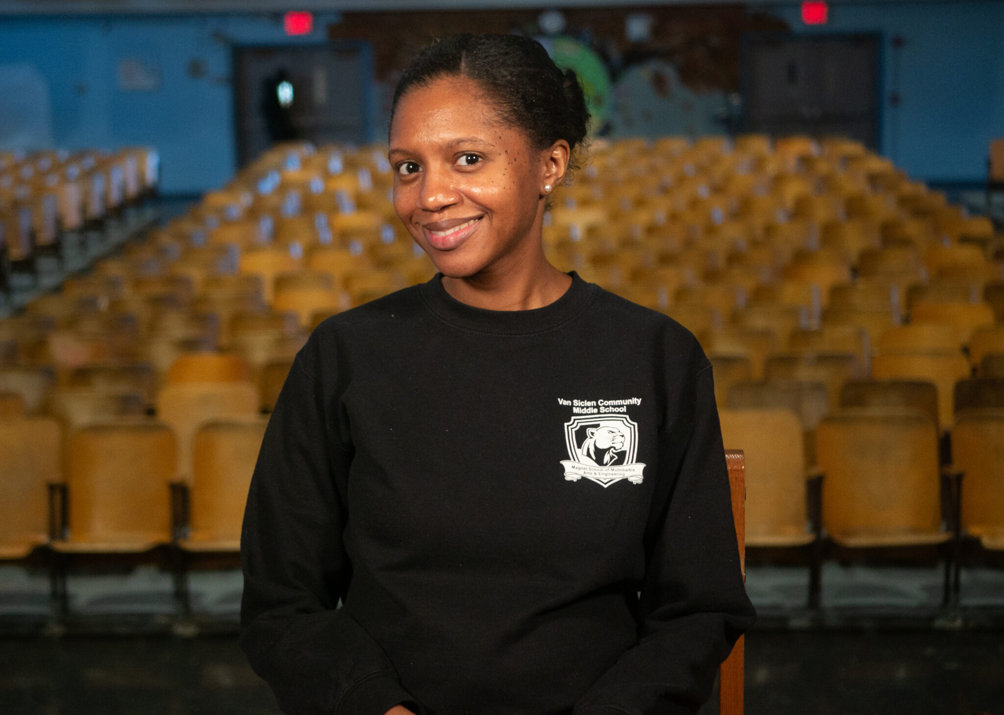 Melissa Murray smiling in Van Siclen Community Middle School auditorium