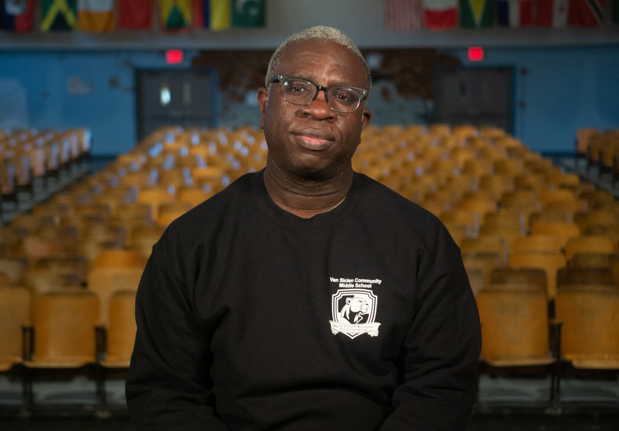 Staff member Gaumarlee Jean Paul in Van Siclen Community Middle School auditorium