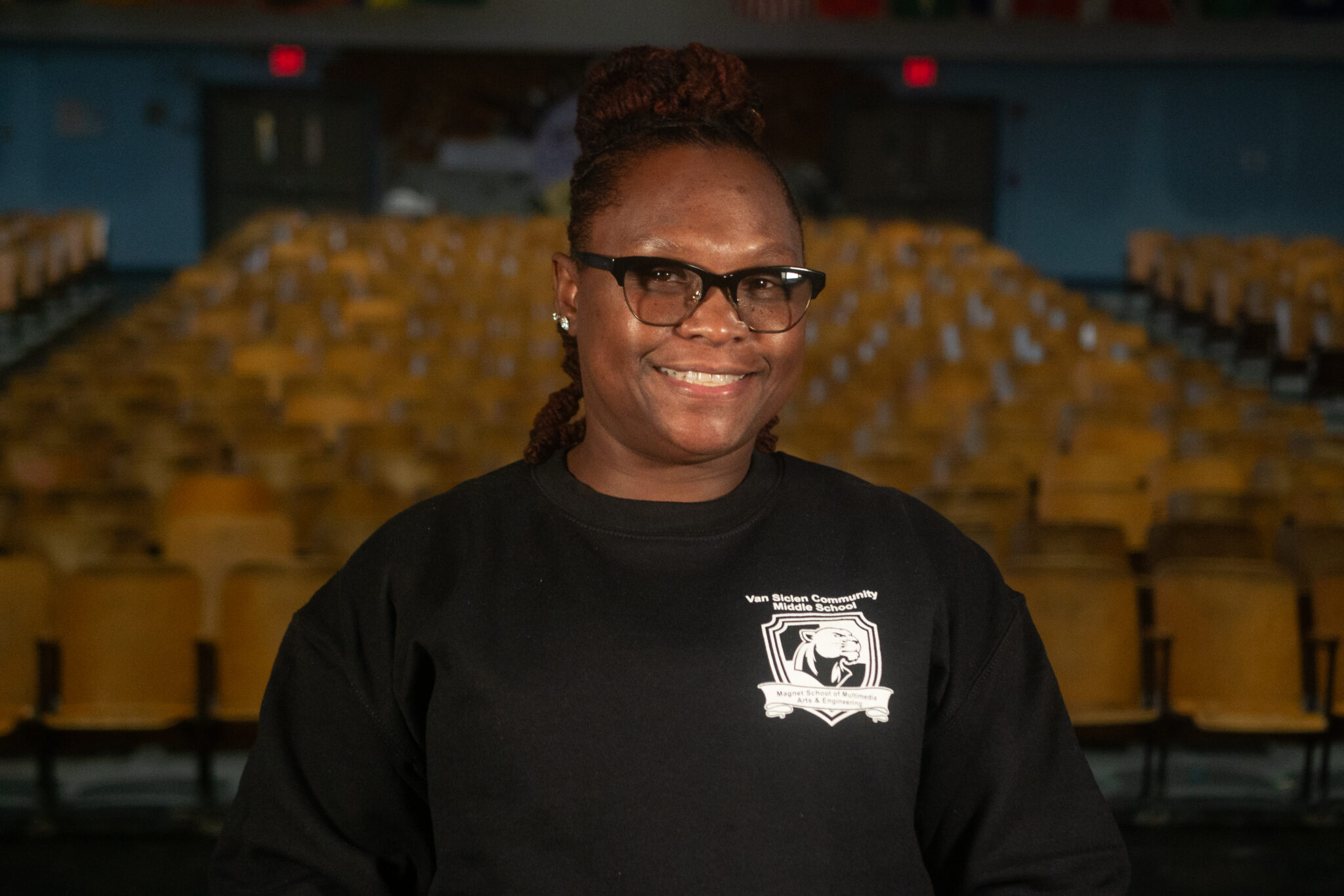 Camille Orta smiling in Van Siclen Community Middle School sweatshirt