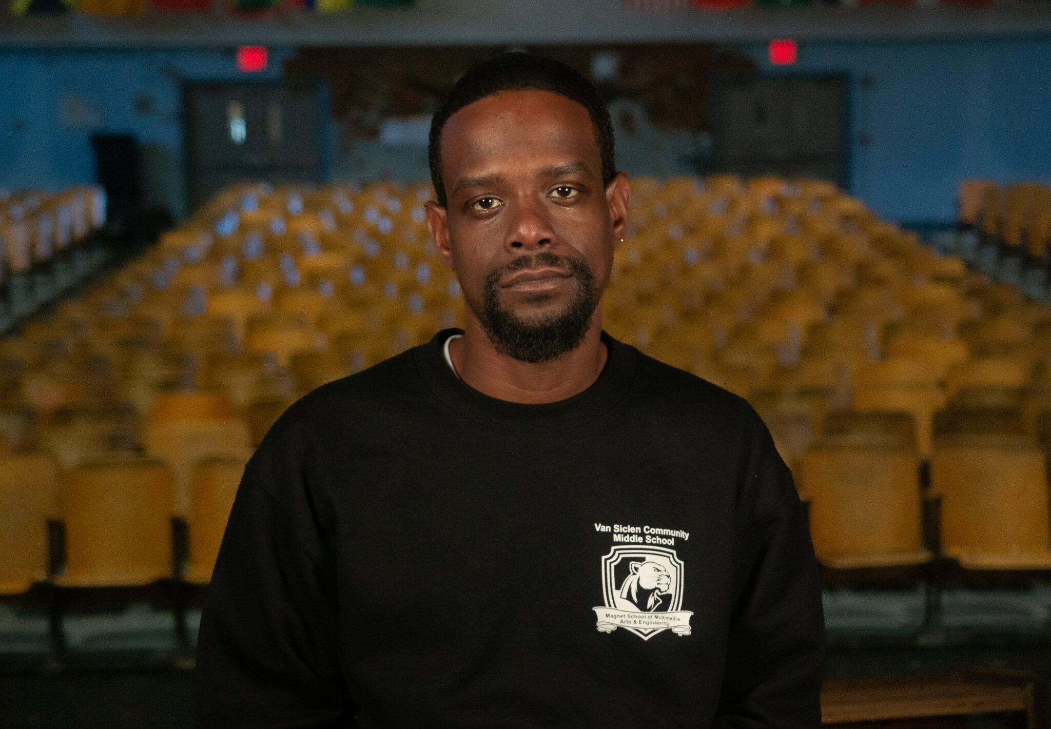 Saquan Spence staff member in Van Siclen Community Middle School auditorium
