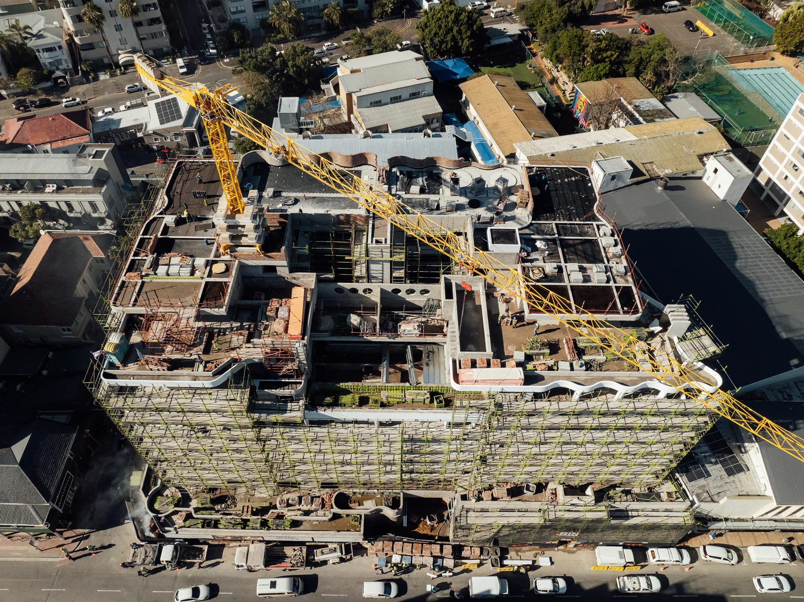 Aerial view of Mont Reve showing the curved roof forms and scaffolded facades