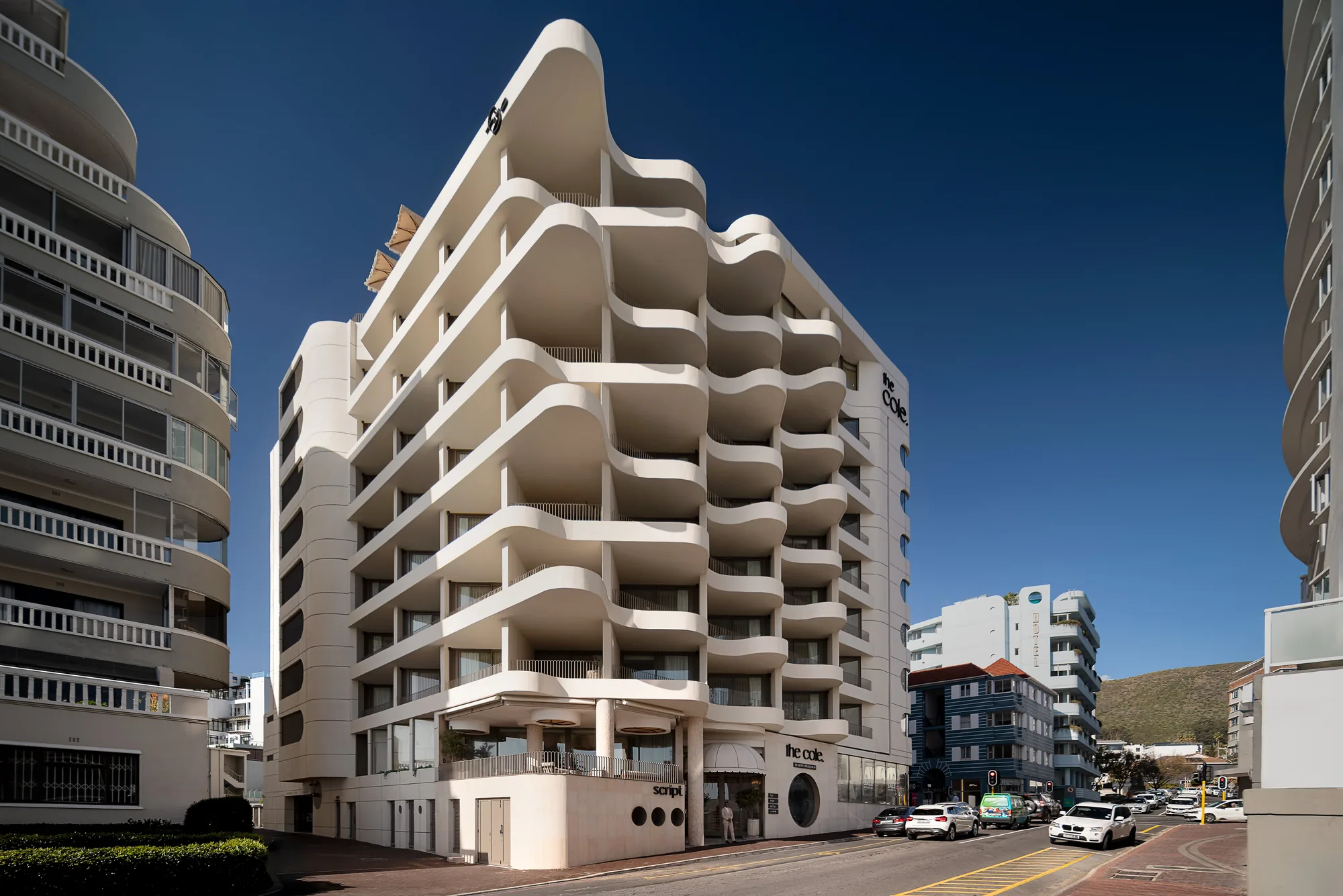 The Cole by Kove Collection at Dolce Vita, Sea Point. Sculptural white balconies against a clear sky.
