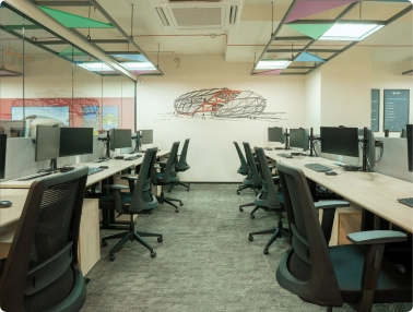 Walter P Moore modern office with rows of black swivel chairs and desks with computer monitors.