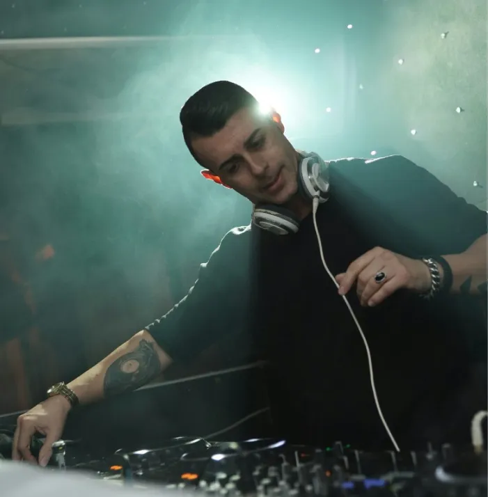 a closeup of a dj black t shirt