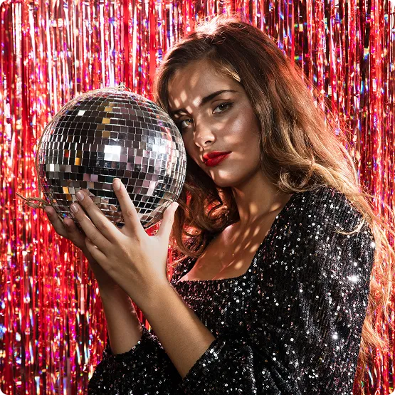a purple lights dance floorin a club girl with disco ball