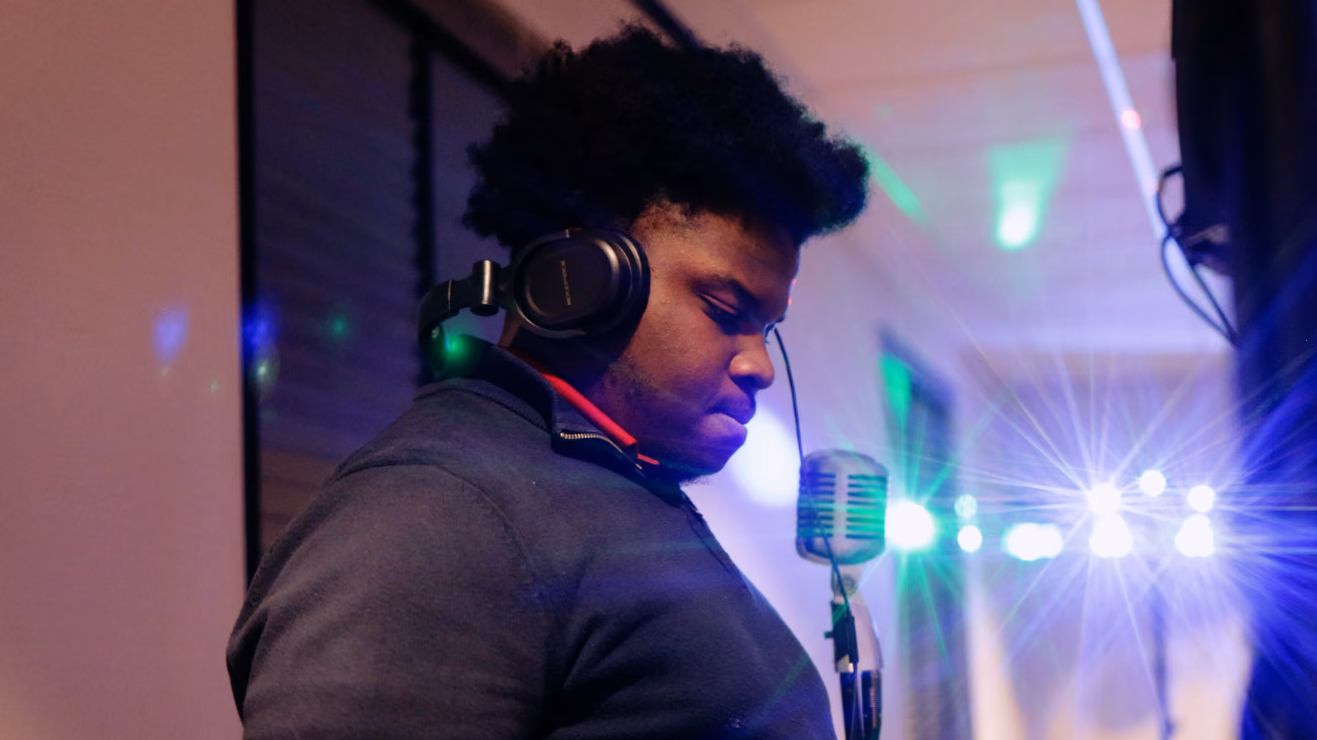 A professional wedding dj wearing headphones to dj an event. 