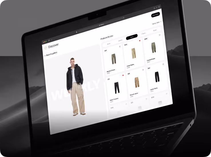Laptop screen displaying a clothing website with a male model wearing beige cargo pants and a black jacket, alongside a product grid of various pants with prices.