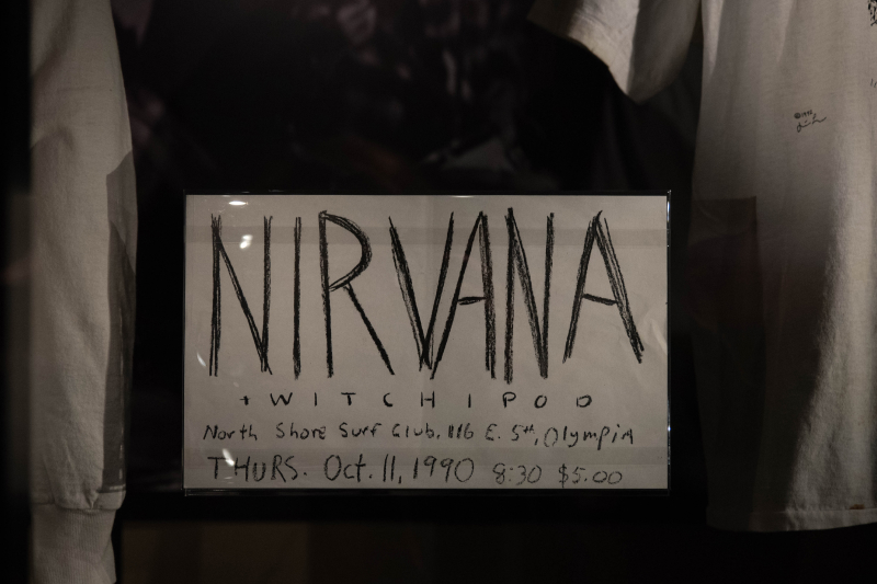 Sign reading: "Nirvana + Witchipoo, North Shore Surf Club, 116 E. 5th, Olypmia, Thurs. Oct. 11, 1990, 8:30, $5.00