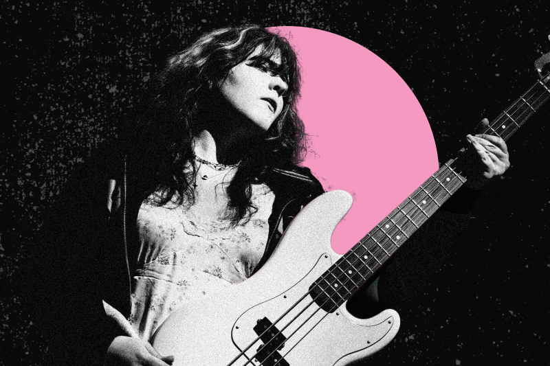 musician holding bass guitar