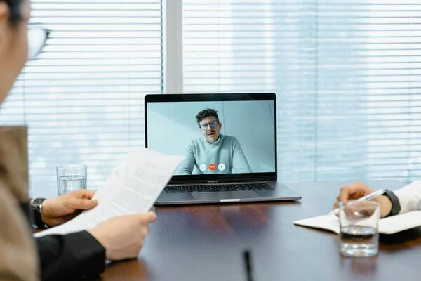 hiring manager conducting virtual online interview to remote candidate