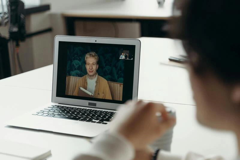 hiring manager conducting virtual online interview to remote candidate